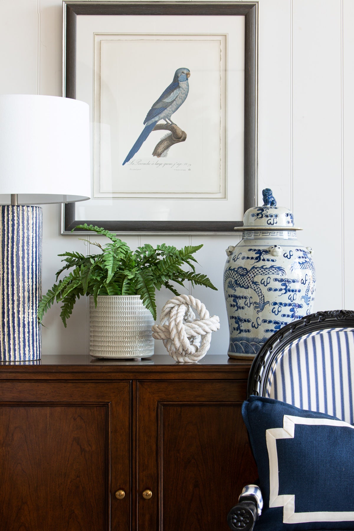 Agatha blue stripe chair featured in living space with a sideboard, lamps, pot plant and artwork