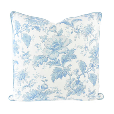 Close up front image of Alice Blue Floral Cushion. Reminiscent of a watercolour painting, with soft blue tones and solid blue piped edging