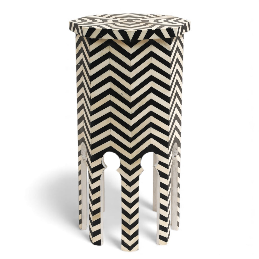 Stool with black and white chevron pattern on a white background