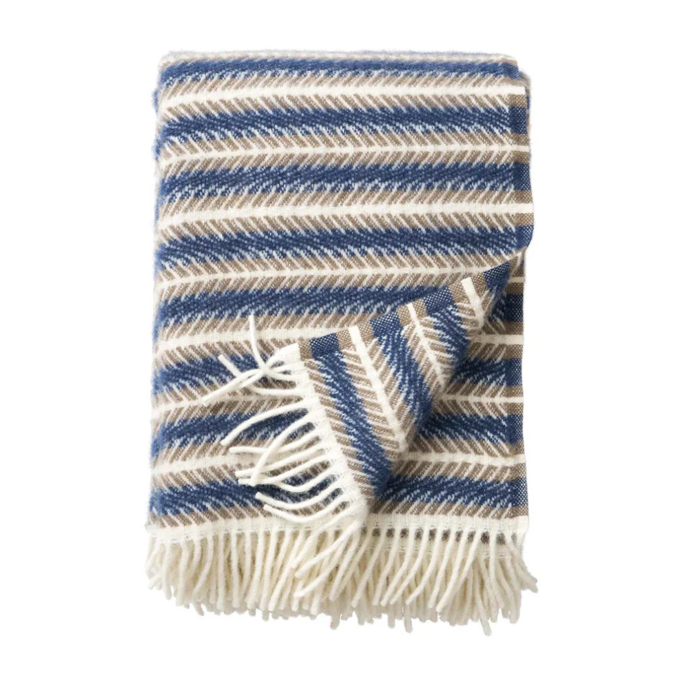 Blue & beige throw blanket with cream coloured fringe edge. 
