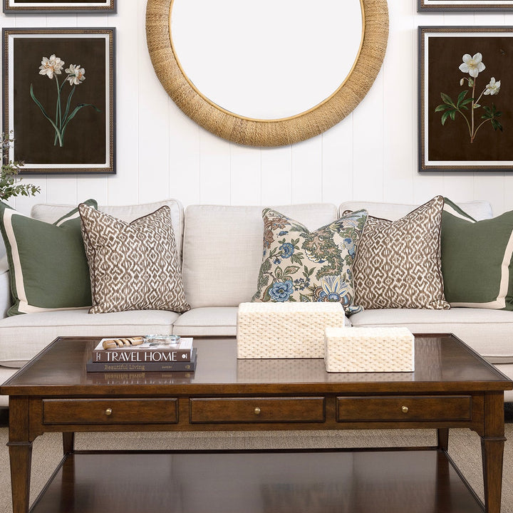 Living room with a sofa, coffee table, and decorative pillows.