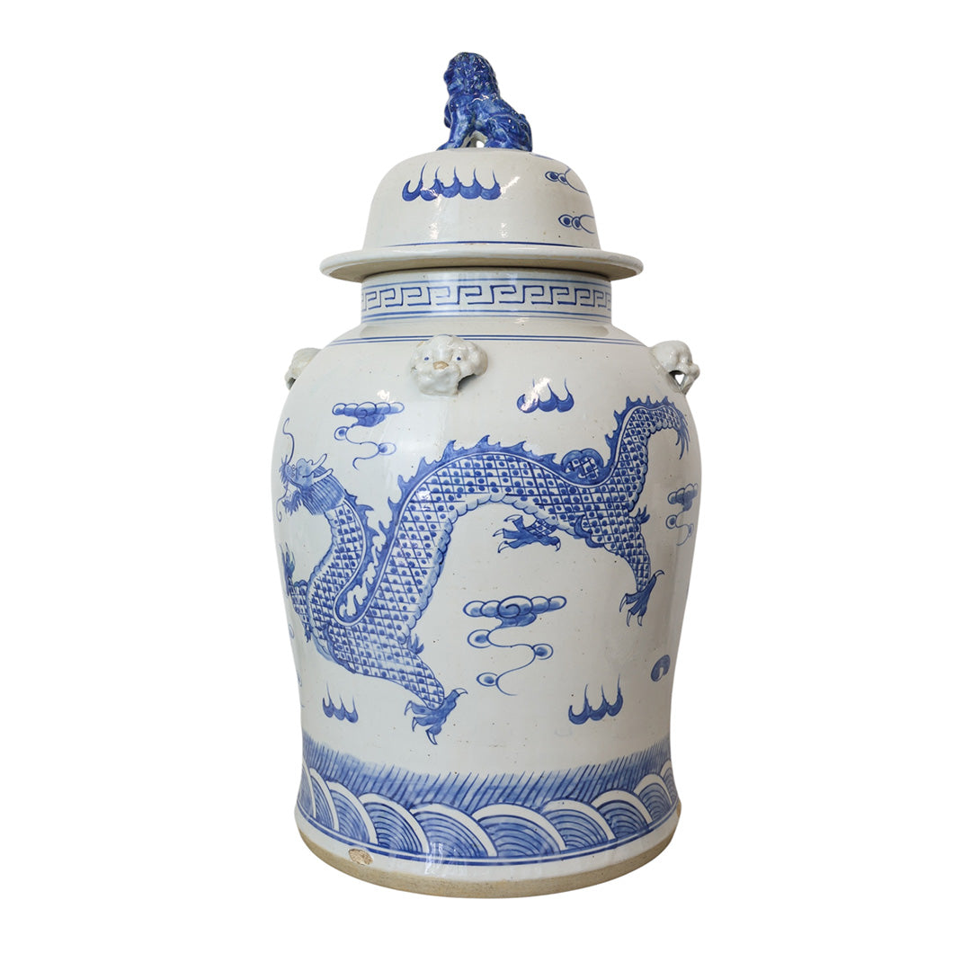 White ceramic jar with blue dragon design on a white background