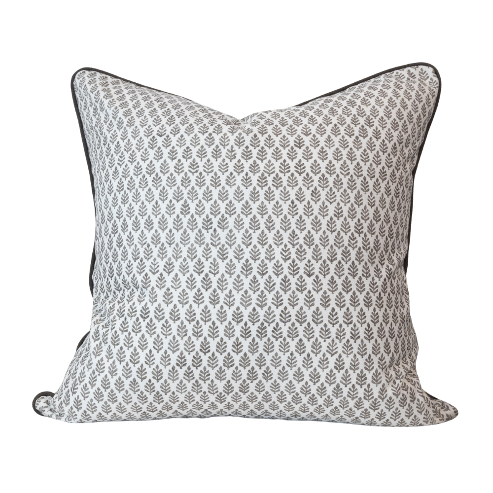 Decorative pillow with a subtle pattern on a white background