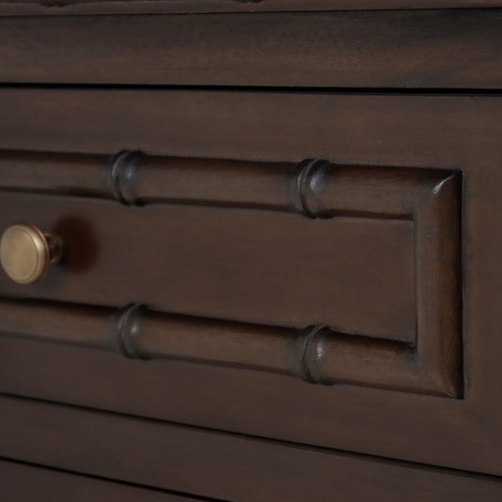 Close-up of a wooden drawer with a metal handle