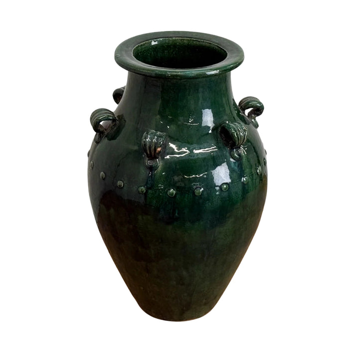 Green ceramic vase with decorative handles on a white background