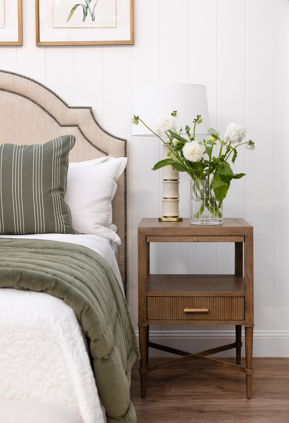 Bedroom with a bed, nightstand, and decorative elements