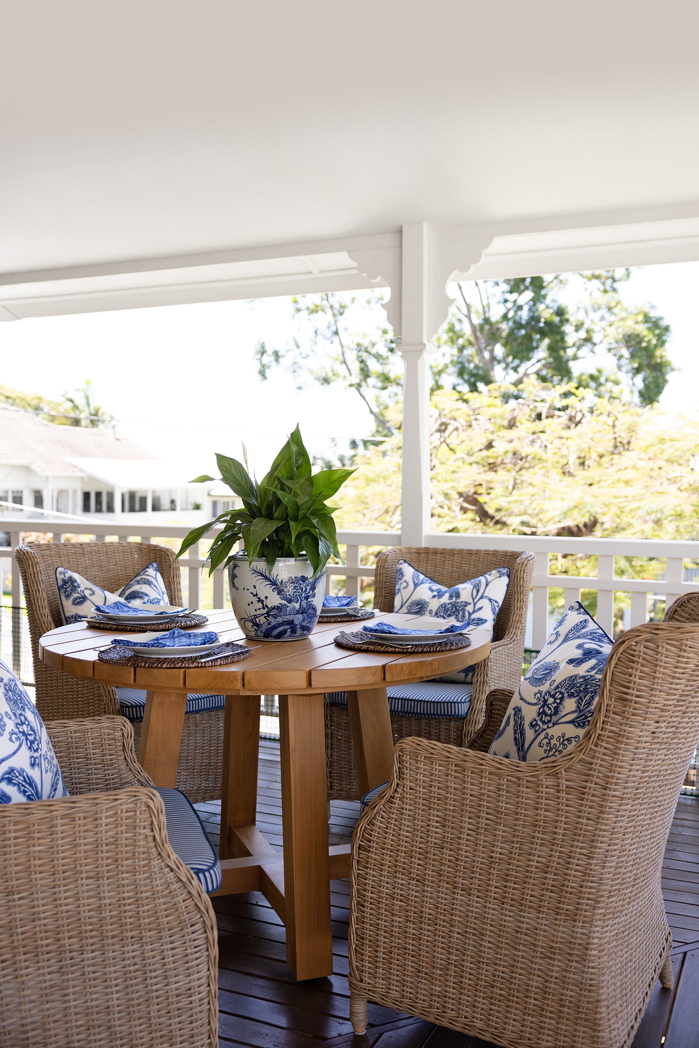 Image of Airlee Outdoor Dining Chair in a table setting with blue cushions