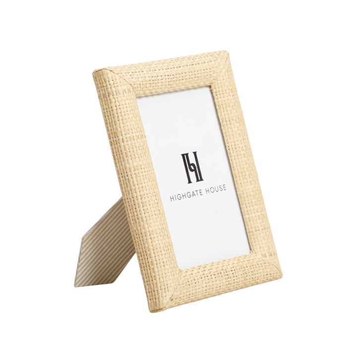 Raffia photo frame with a white card inside on a white background
