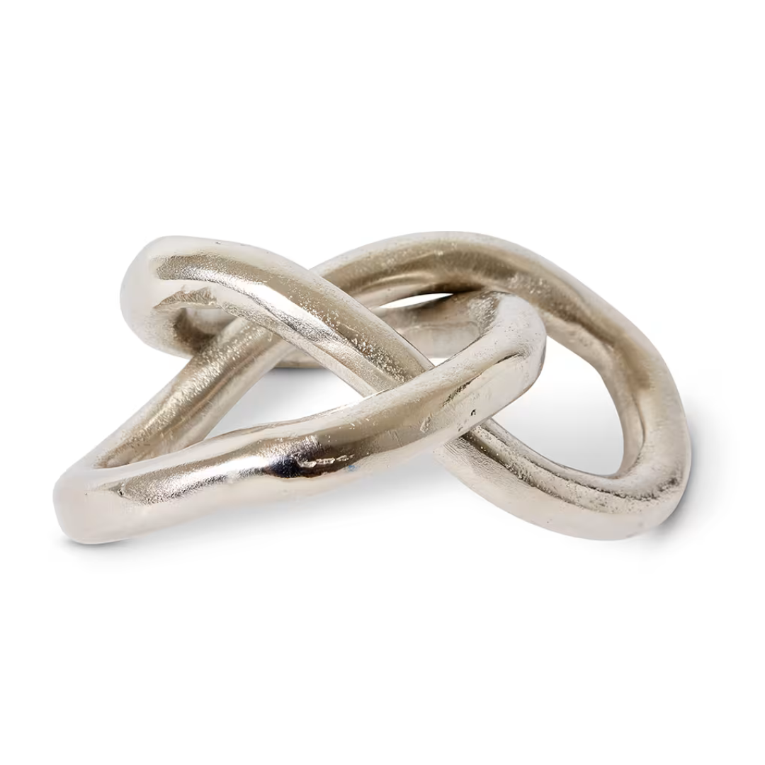 Silver interlocking rings on a white background