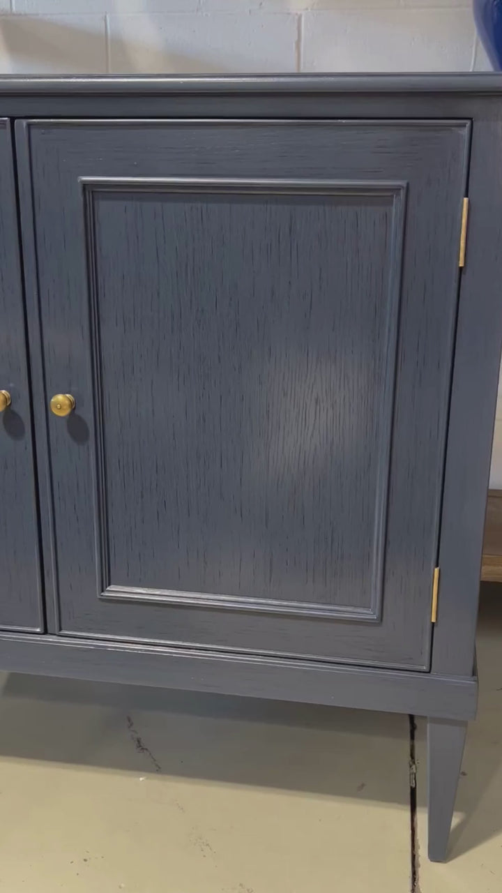 Video showing surface of navy cabinet