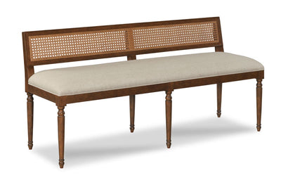Image of timber bench with cane panel on the back and neutral linen coloured seat.
